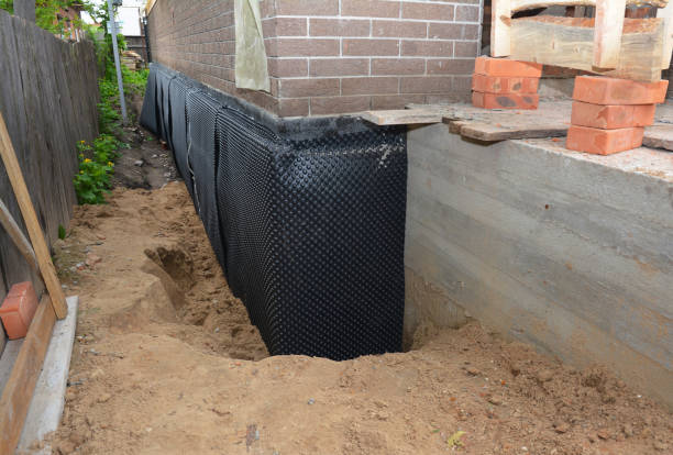 Happy homeowners after waterproofing job in Concord
